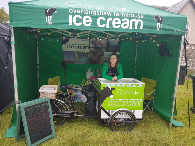 Exhibitor under a green gazebo