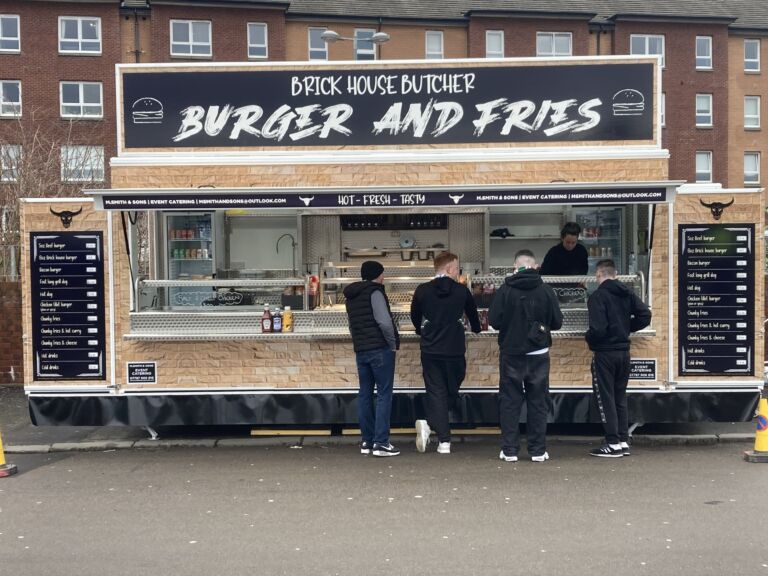 Customers at a burger stall