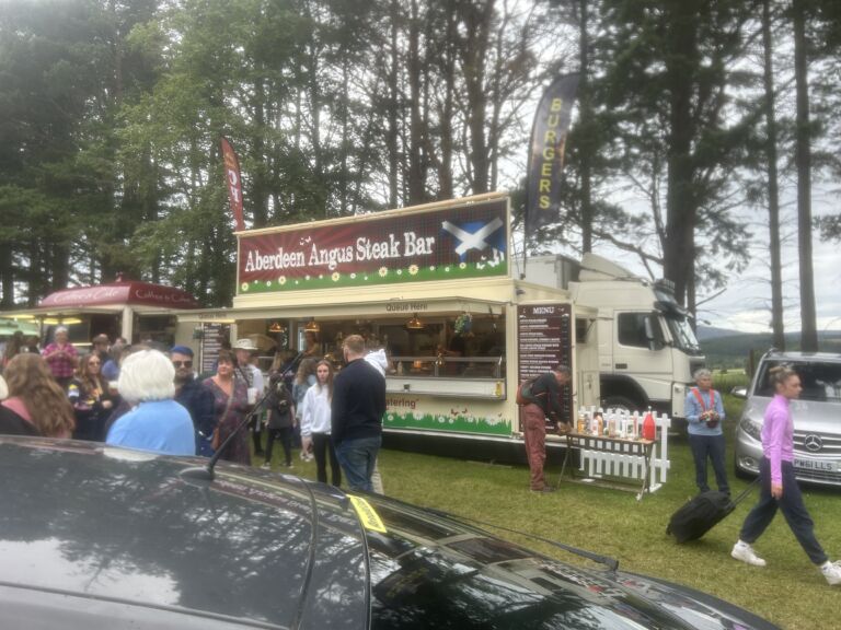 Visitors at a stall in the trade village